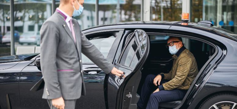 Man Getting Out of Taxi