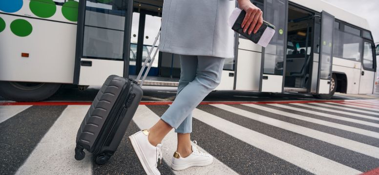 Female with Luggage Approach Shuttle Bus